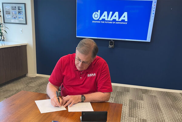 AIAA CEO Dumbacher Signs UN Policy Doc 4Jan2024 feature